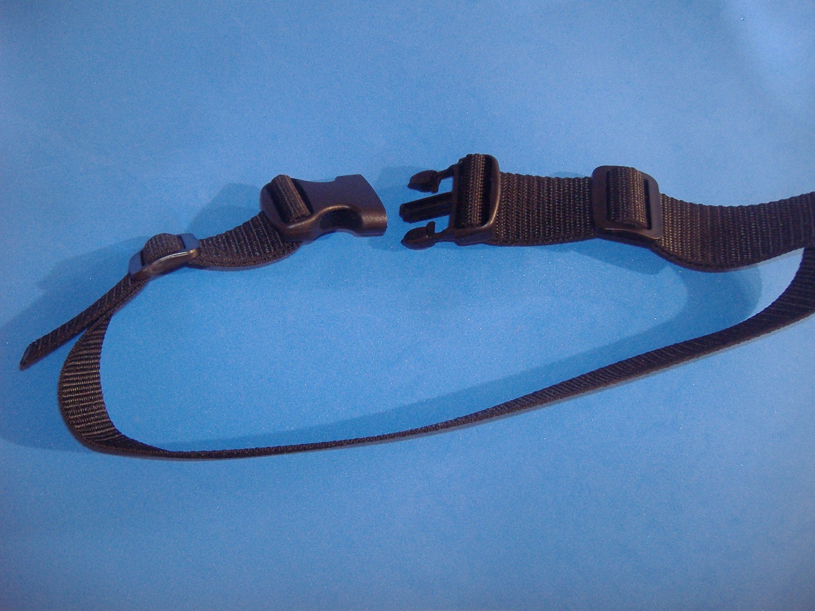 ADJUSTABLE NYLON WEB STRAP PLASTIC BUCKLE MAXIMUM 34″ LONG 1 1/2″ WIDE BLACK